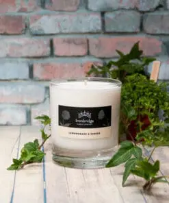 A candle sitting on top of a wooden table.