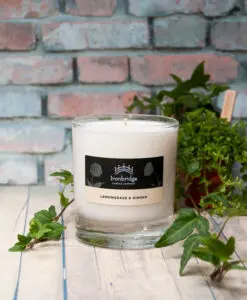 A candle sitting on top of a wooden table.