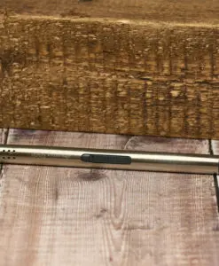 A wooden floor with a pen laying on it