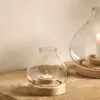 Small Naryla lantern with a recycled glass bulb shape that sits perfectly in a solid mango wood base