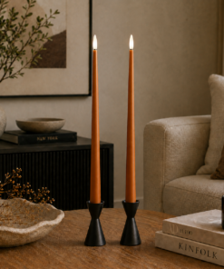 Lifestyle image showing ester & erik LED Taper Candles 40cm in length in colour: Raw Roffee
