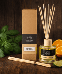 Lime, Basil & Mandarin reed diffuser in clear glass with natural reeds and fresh citrus fragrance