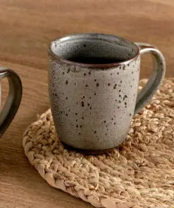 Cam Large Mug - Mocha Set of 2 by Nkuku, showing two large ceramic mugs with warm mocha colouring, a soft mottled reactive glaze and rustic handmade-style finish.