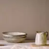 Malia Jug - Cream - Small by Nkuku showing the handcrafted stoneware texture, soft cream colour and rustic glazed finish.