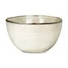 Close-up of the Malia Serving Bowl - Cream by Nkuku, showing the cream stoneware surface, subtle reactive glaze variation and fine hand-painted line detail around the rim.