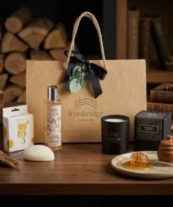 Dark Honey & Tobacco Candle & Skin Care Gift Set – Everyday Treat styled in a warm luxury setting with rich amber and wood tones.