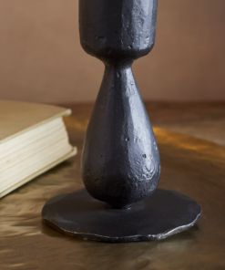 Close-up of the Suba Candle Holder in Black by Nkuku showing the hand-forged textured iron finish.