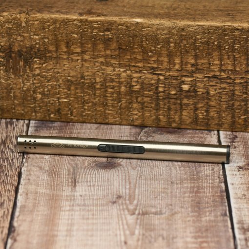 A wooden floor with a pen laying on it