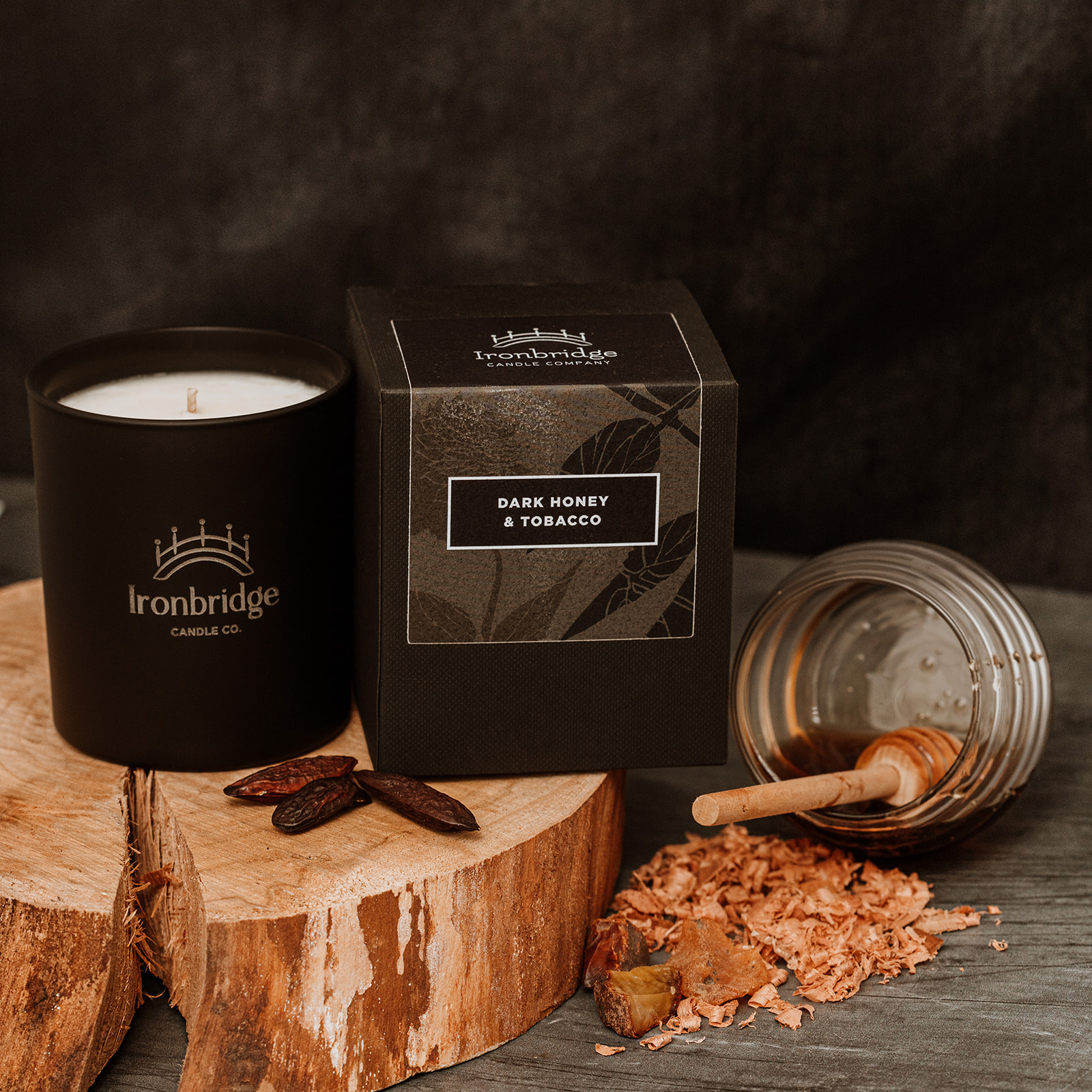 Warm smoky Dark Honey & Tobacco vegetable wax luxury candle in black etched matt glass with up to 45 hours burn time