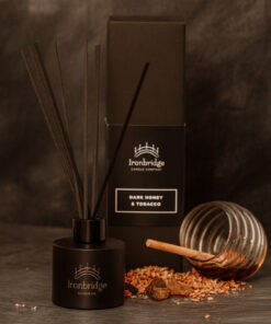 Dark Honey & Tobacco reed diffuser in matt black etched bottle with smoky honey and tobacco fragrance