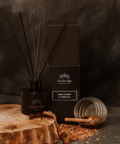 Dark Honey & Tobacco reed diffuser in matt black etched bottle with smoky honey and tobacco fragrance
