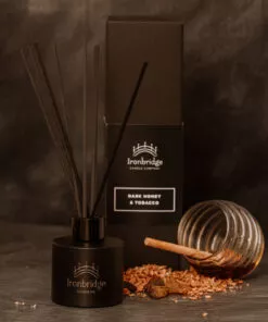 Dark Honey & Tobacco reed diffuser in matt black etched bottle with smoky honey and tobacco fragrance
