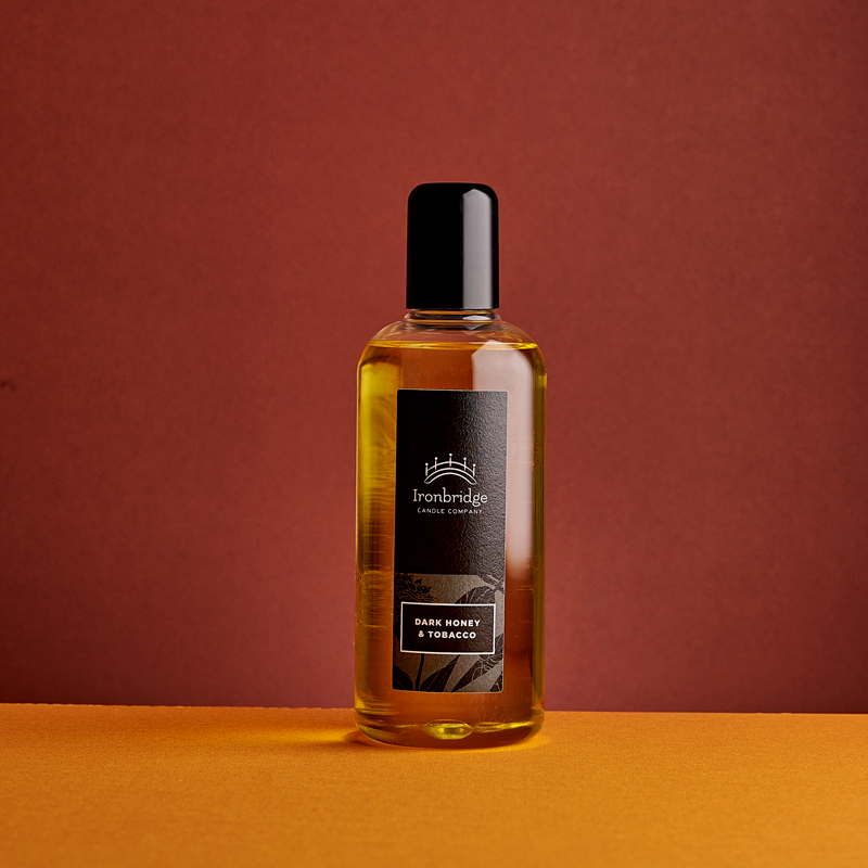 Dark Honey & Tobacco reed diffuser refill in 250ml bottle with warm smoky fragrance