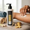 Lemongrass & Ginger hand and body lotion being massaged into the skin, with a fresh citrus fragrance and warming ginger notes for an uplifting daily body-care routine