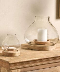 Naryla lantern with a recycled glass bulb shape that sits perfectly in a solid mango wood base