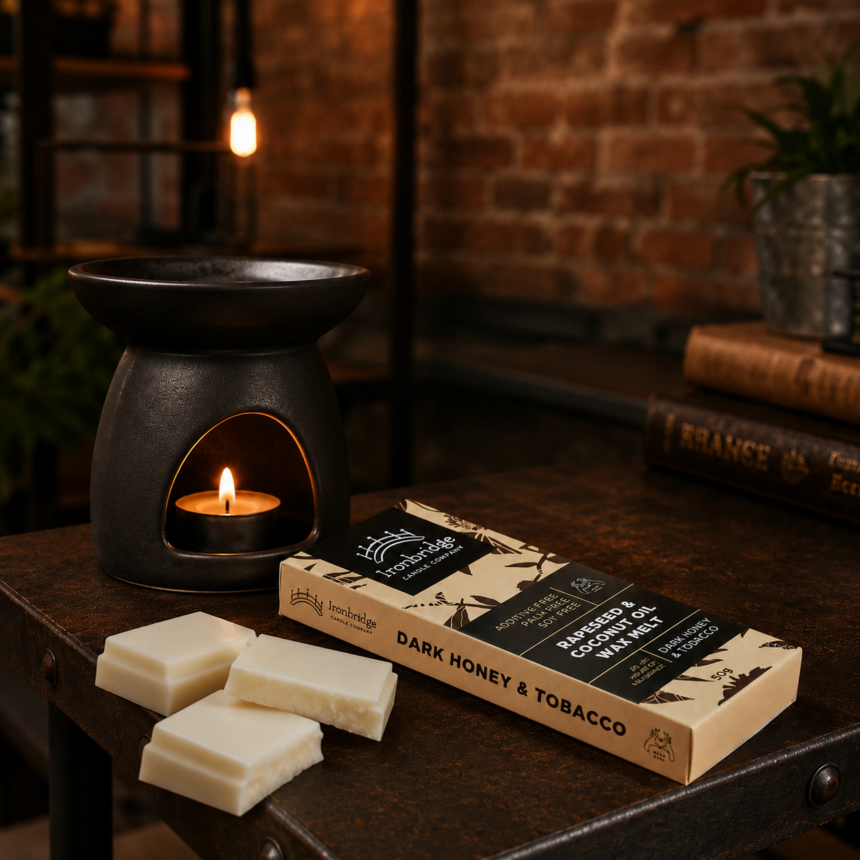 Dark Honey & Tobacco wax melt snap bar with warm smoky honey and tobacco fragrance, litstyle inmage showing wax melts with burner, handmade by Ironbridge Candle Company