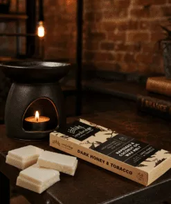Dark Honey & Tobacco wax melt snap bar with warm smoky honey and tobacco fragrance, litstyle inmage showing wax melts with burner, handmade by Ironbridge Candle Company