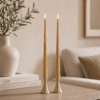 Lifestyle image showing ester & erik LED Taper Candles in 40cm length in colour Almond Butter