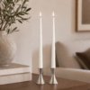 Lifestyle image showing ester & erik LED Taper Candles in 30cm length in colour Silky