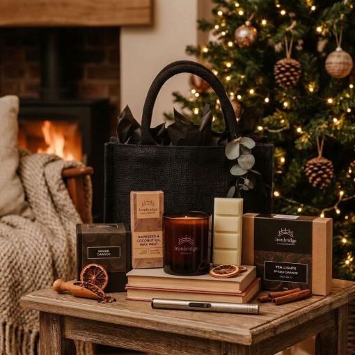 Winter Radiance Gift Set with Black Jute Bag, containing a candle, wax melt snap bar, scented tea lights and a candle lighter