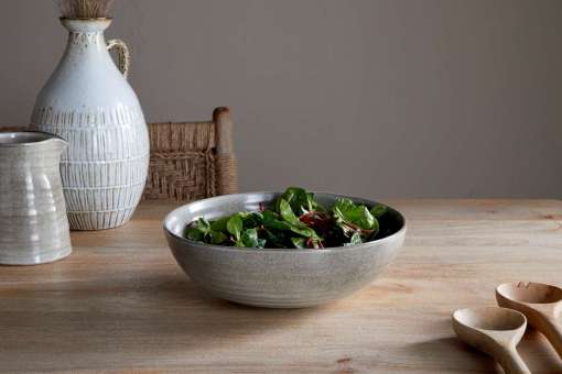 Valinha earthenware collection by Nkuku, showing coordinated grey serving and tableware pieces with textured spiral detail, layered reactive glaze and rustic Portuguese earthenware finish.