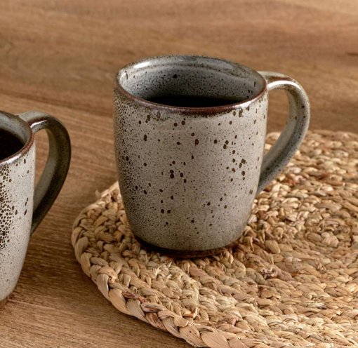 Cam Large Mug - Mocha Set of 2 by Nkuku, showing two large ceramic mugs with warm mocha colouring, a soft mottled reactive glaze and rustic handmade-style finish.