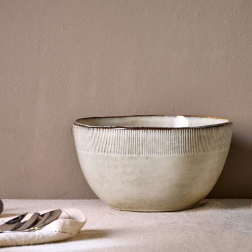Malia Serving Bowl - Cream by Nkuku, a large 3100ml cream stoneware serving bowl with rounded shape, hand-painted rim detail and soft reactive glaze.