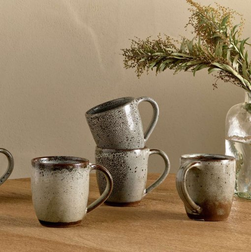 Cam Large Mug - Mocha by Nkuku styled for tea or coffee, showing the generous mug shape, rustic ceramic glaze and relaxed neutral kitchenware style.