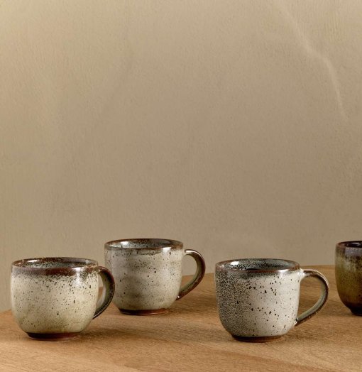 Cam Coffee Mug - Mocha Set of 2 by Nkuku, showing two handcrafted ceramic mugs with a warm mocha colour and soft reactive glaze finish.