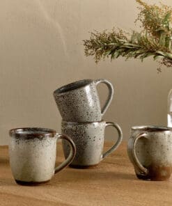 Cam Large Mug - Mocha by Nkuku styled for tea or coffee, showing the generous mug shape, rustic ceramic glaze and relaxed neutral kitchenware style.