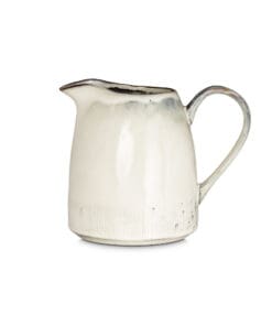 Malia Jug - Cream - Large by Nkuku showing the rounded stoneware body, 1890ml capacity, pouring lip, cream glaze variation and hand-painted line detail.