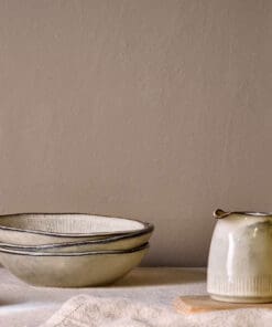 Malia Jug - Cream - Small by Nkuku showing the handcrafted stoneware texture, soft cream colour and rustic glazed finish.