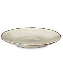 Close-up of the Malia Side Plate - Cream by Nkuku, showing the cream stoneware surface, fine hand-painted line detail and subtle glaze variation around the rim.