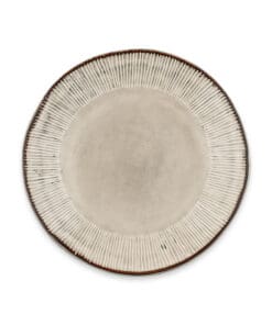 Close-up of the Malia Side Plate - Cream by Nkuku, showing the cream stoneware surface, fine hand-painted line detail and subtle glaze variation around the rim.