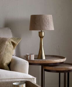 Marpha Antique Brass Table Lamp styled in a living space, bringing warm brass tones and understated character to the room.
