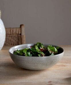 Valinha earthenware collection by Nkuku, showing coordinated grey serving and tableware pieces with textured spiral detail, layered reactive glaze and rustic Portuguese earthenware finish.