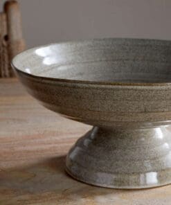 Close-up of the Valinha Earthenware Footed Bowl - Grey by Nkuku, showing the textured earthenware surface, spiral detail and tonal variation in the grey glaze.