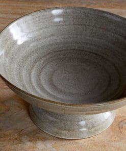 Close-up of the Valinha Earthenware Footed Bowl - Grey by Nkuku, showing the textured earthenware surface, spiral detail and tonal variation in the grey glaze.