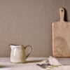 Malia Jug - Cream - Small by Nkuku, a small stoneware serving jug with a soft cream reactive glaze and hand-painted line detail.