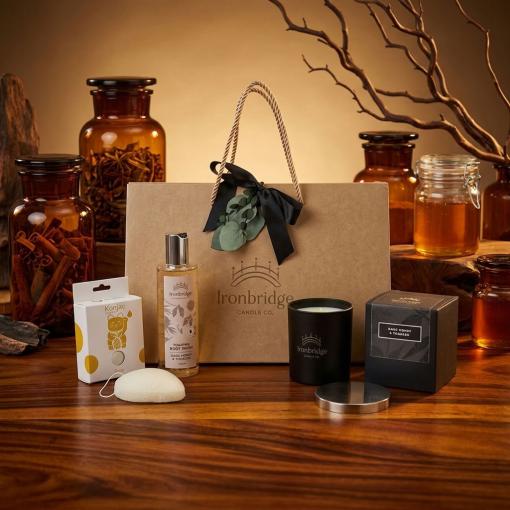 Dark Honey & Tobacco Candle & Skin Care Gift Set – Everyday Treat presented as a premium gift with warm golden lighting and natural styling.