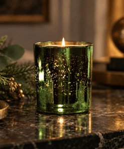 Lit Frankincense & Myrrh Luxury Scented Candle in Limited Edition emerald electroplated glass, with a warm woody, sweet and musky fragrance.
