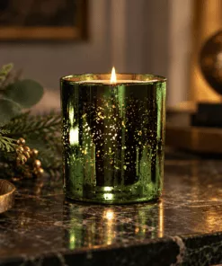 Lit Frankincense & Myrrh Luxury Scented Candle in Limited Edition emerald electroplated glass, with a warm woody, sweet and musky fragrance.