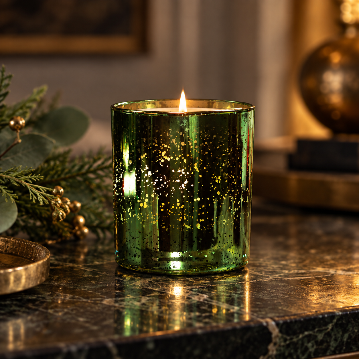 Lit Frankincense & Myrrh Luxury Scented Candle in Limited Edition emerald electroplated glass, with a warm woody, sweet and musky fragrance.